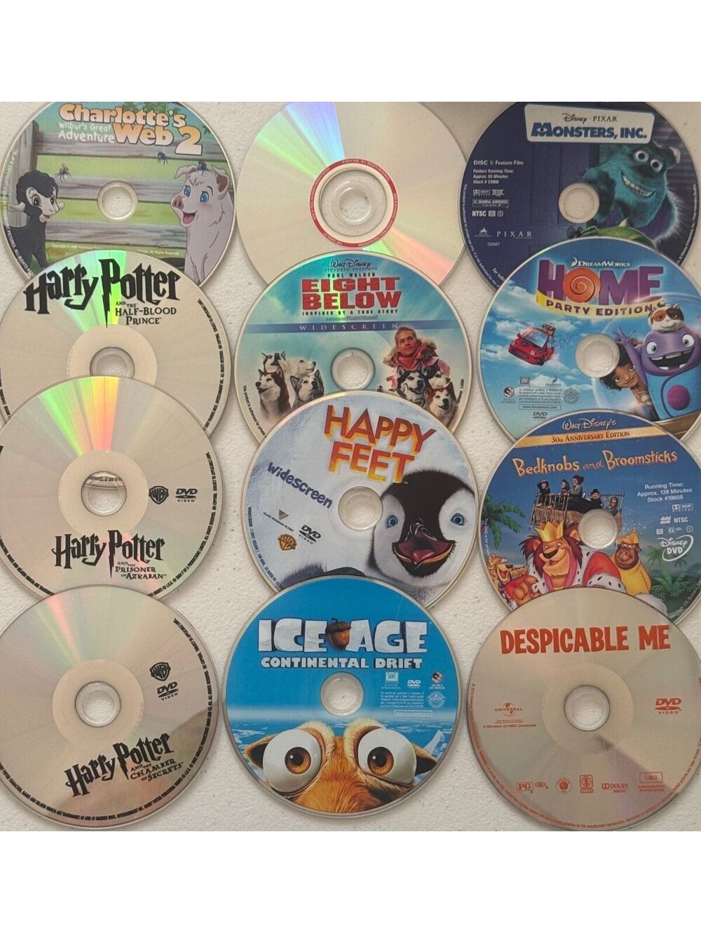 12 Family DVDs No Covers All In A Ridged Case Harry Potter Disneys & More